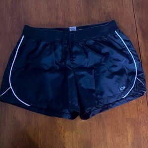 Black athletic shorts with white piping